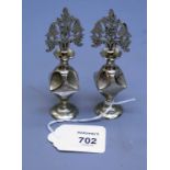 A pair of late 19th century Italian anointing bottles, the nickel silver lobed flasks with foliate