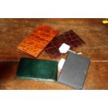 Two brown crocodile wallets and two cigarette cases