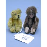 A small Schuco blonde mohair bear, fully jointed, together with a similar brown mohair monkey, 7 and