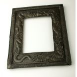 A late 19th/early 20th century Chinese white metal picture frame, decorated in relief with twin