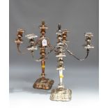 A pair of Victorian silver plated on copper table candlesticks, each having two reeded scrolling