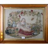 A Victorian petit point needlework, woven with a lady seated beneath a vine-clad arbour, 36 x 46cm