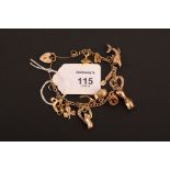 A 9ct gold chain bracelet, the open link chain with a variety of gold and gilt metal charms