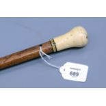 An early 19th century malacca dandy cane with ivory knop handle, 87cm