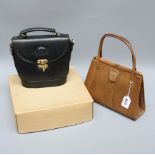 A small black handbag, monogrammed, together with a brown lizard skin handbag