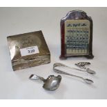 A silver cigarette box, 3 x 9 x 8cm, together with a silver desk calendar with ivorine leaves, a