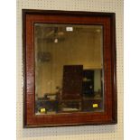 A Victorian inlaid satinwood rectangular wall mirror with raised moulded frame, 70cm wide