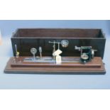 A circa 1960's manual Testrite yarn shrinkage and force tester, in a fitted mahogany case, 17 x 63 x