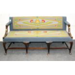 A 19th century mahogany framed, gros point florally upholstered three person hall settee having a