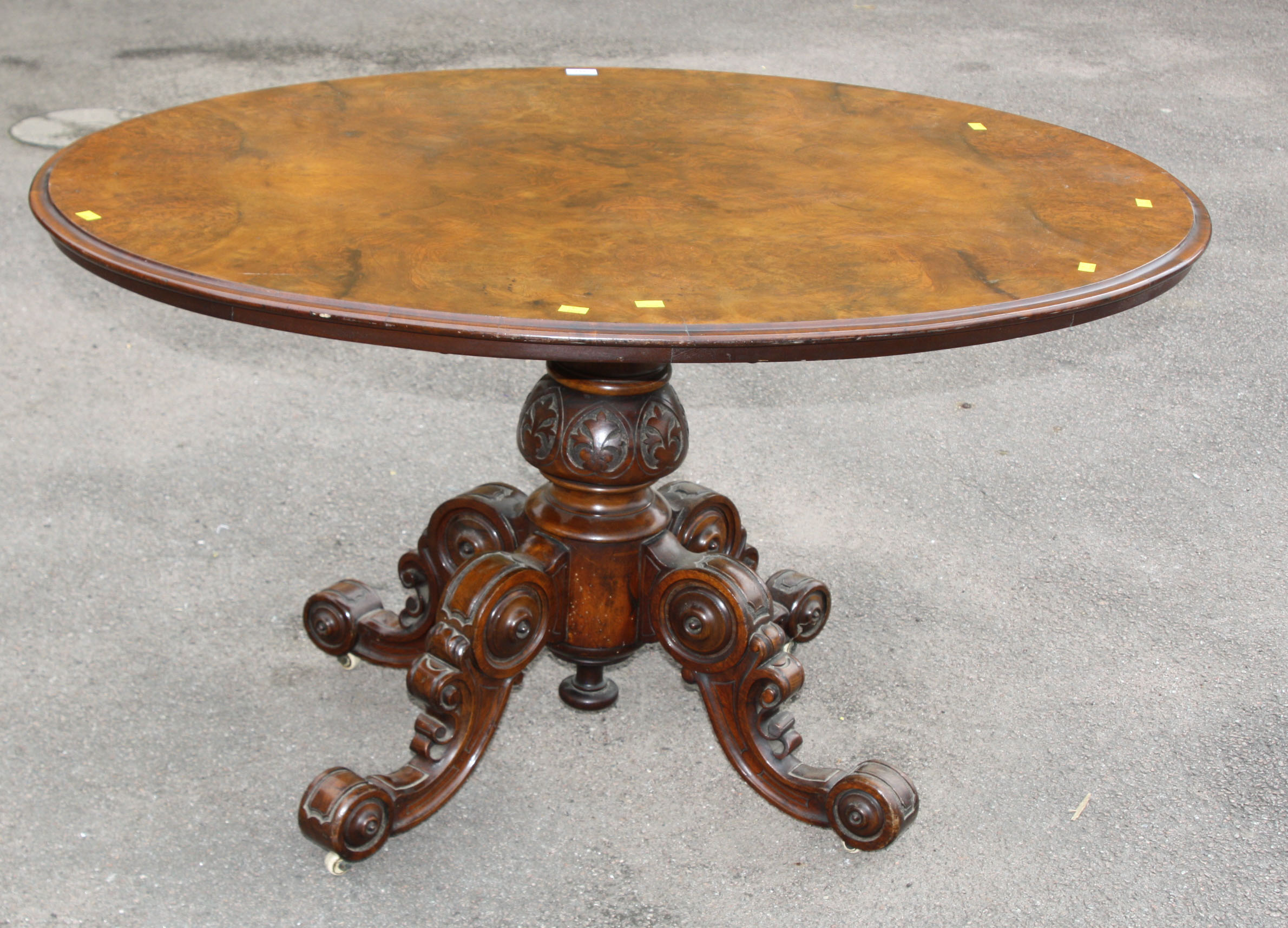 A Victorian framed walnut oval centre table with well carved, quadrupedal base, 131cm wide