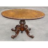 A Victorian framed walnut oval centre table with well carved, quadrupedal base, 131cm wide