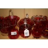 A collection of Victorian and later cranberry glass, including a mid 19th century heart shaped nut