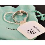 Tiffany, a gentleman's heavy plain platinum band, signed 'Tiffany & Co.' in Tiffany bag