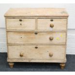 A Victorian stripped pine chest, of two short over three long drawers
