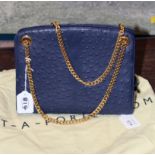A Saks Fifth Avenue blue handbag with gold chain straps