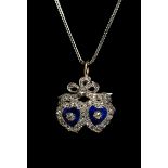 A Victorian diamond and enamel double heart-shaped pendant, the blue guilloché enamel hearts with