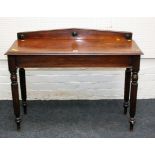 A William IV mahogany side table, the architectural upstand over rectangular top with moulded edge