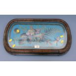 A Victorian beadwork tray, decorated with butterfly ferns and flowers in a moulded walnut frame,