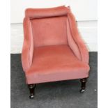 A Victorian salmon plush upholstered parlour armchair, with rolled back, downswept arms, overstuffed