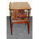 An Edwardian mahogany and satinwood strung revolving bookcase, the serpentine square top over a