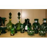 A pair of Victorian pale green glass spirit decanters and stoppers of baluster form, simply