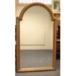 A large 19th century giltwood overmantel mirror, the stepped arch frame with pin scale decoration