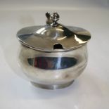 Pairpoint Brothers a silver lidded mustard form with urn finial, eared thumbpiece and swept