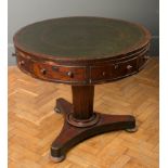 An early Victorian mahogany drum table, the circular top inset with gilt tooled gent's hide over