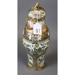 A 19th century Chinese famille rose Canton baluster vase and cover, with dragon draped neck and dome