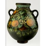 An Aesthetic Movement Doulton Lambeth faience vase of twin loop handled baluster form dated 1879,