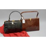 A brown crocodile handbag, together with a small black handbag