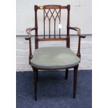 An Edwardian inlaid mahogany Waring & Co of London Paris and Madrid etc open armchair, with