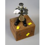 W. Watson and Sons Ltd, a mid 20th century black steel and brass student's microscope, with two
