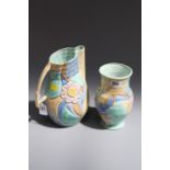 A 1930s Beswick ware jug of baluster form with sloping angular handle, florally pastel decorated