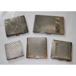 An Art Deco silver compact with gold inlay, an Art Deco engine turned cigarette case with reeded
