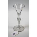 An 18th century conical ale glass, with air twist baluster column and spreading foot, 17cm high