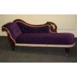 A Victorian walnut framed chaise longue, having a rolled end, swept pierced back, overstuffed