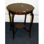 An Edwardian mahogany centre table, with piecrust top, on slender cabriole legs. 72 x 59cm