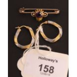 A bar brooch with circular cut amethyst and white and green enamel detail, together a pair of bi-