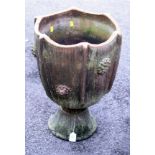 A 20th century studio pottery terracotta garden planter, of ridged circular form with boss