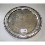 A Victorian silver salver, circular with raised lattice-pierced border, scroll engraved to centre