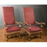 A pair of 17th century Italianate style carved wood and gilt gesso throne armchairs with scroll arms