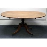 A Regency mahogany breakfast table, the rosewood crossbanded and strung oval tilt top on a ring