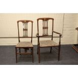 An Edwardian mahogany and boxwood strung open salon armchair, together with a conforming standard