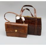 A brown crocodile skin handbag together with one other