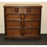 A 1930s oak geometrically moulded chest of three short over three long drawers, 107cm