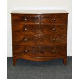 An early 19th century figured mahogany bow front chest of two short over three long drawers, 105cm