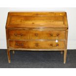 Eric Marjolet, a 20th century French cherrywood bureau, the panelled fall with brass shield