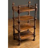 A Victorian walnut gallery topped four tier whatnot with barley twist columns and bun feet, 51cm