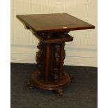 A 19th century Swiss walnut pedestal, with quadruple column and caryatid pillars, circular plinth